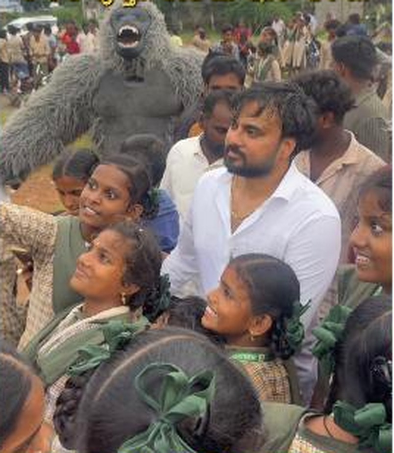 School programme distributing books and sports materials.